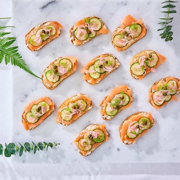Halal Signature Canapés: smoked salmon dill cream cheese crostini with cucumber, capers and pickled shallot