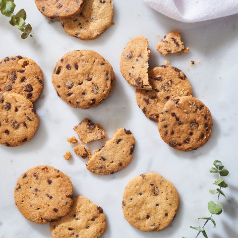 A selection of chocolate chip cookies against a pristine white backdrop, from the Abundance Gift Box.