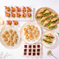 Halal Hi-Tea Set Deluxe spread: chilli prawn cups, croissant sandwiches, vol-au-vents, choux puffs and mini cheesecakes