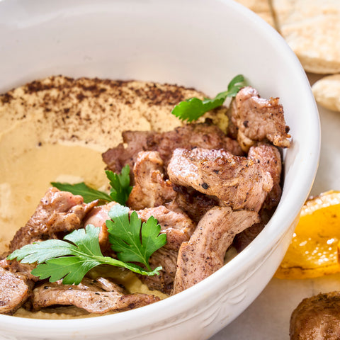 Pan-fried lamb on hummus