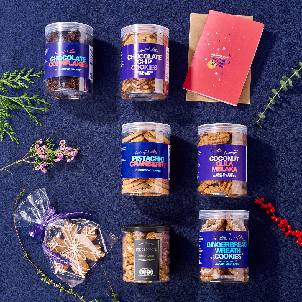 Flat lay of Christmas cookies with a greeting card.