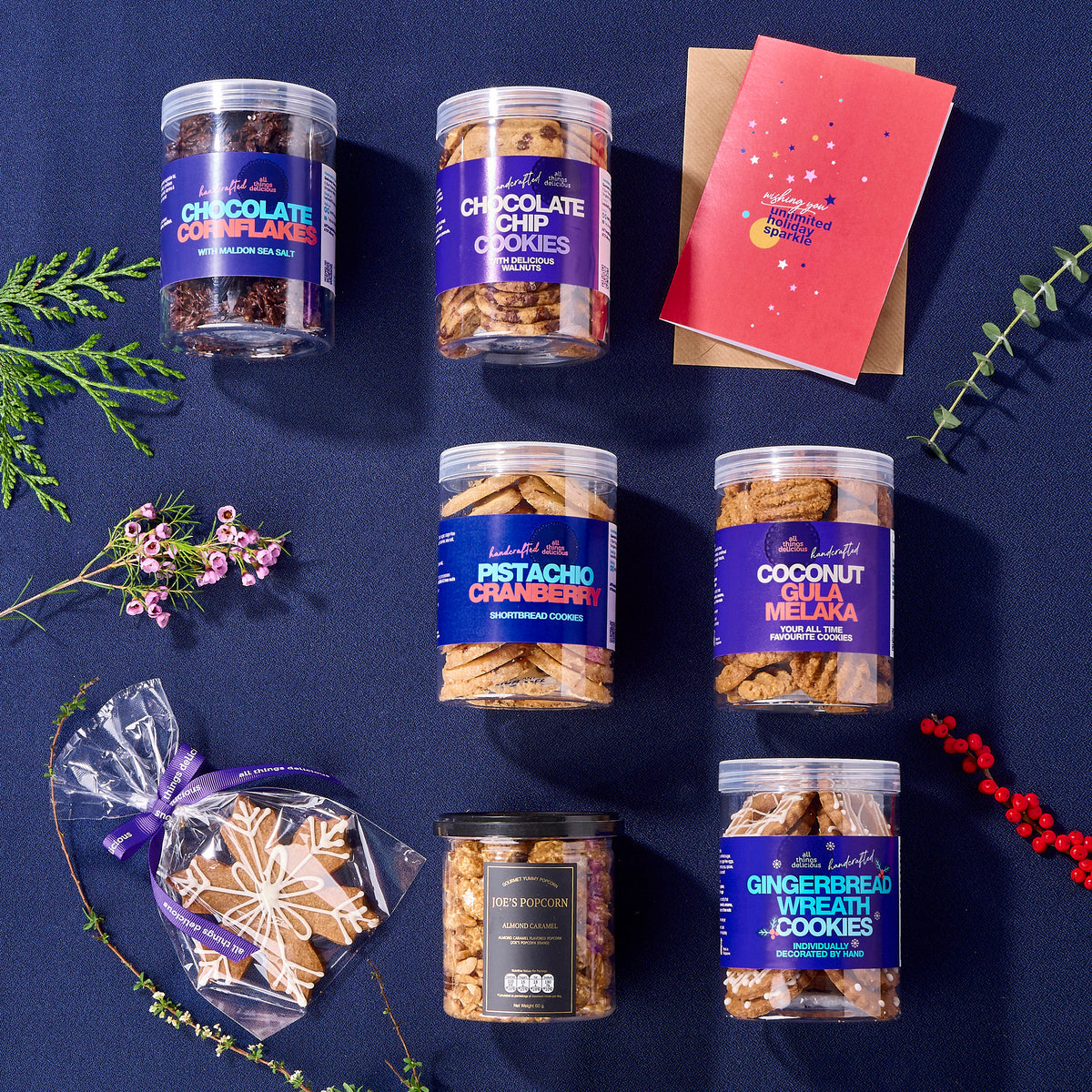 Flat lay of Christmas cookies with a greeting card.