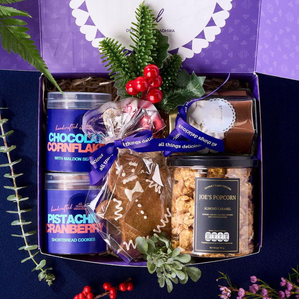 Christmas gift box contents: chocolate cornflakes, shortbread, popcorn and hot chocolate