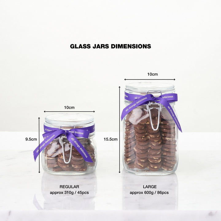 Side by side comparison of our glass cookie jars filled with Chocolate Almond Shortbread