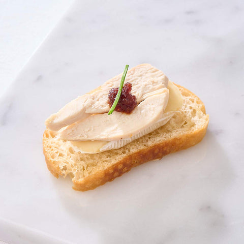 Close up fo Brie, Cranberry & Turkey Ham Crostini
