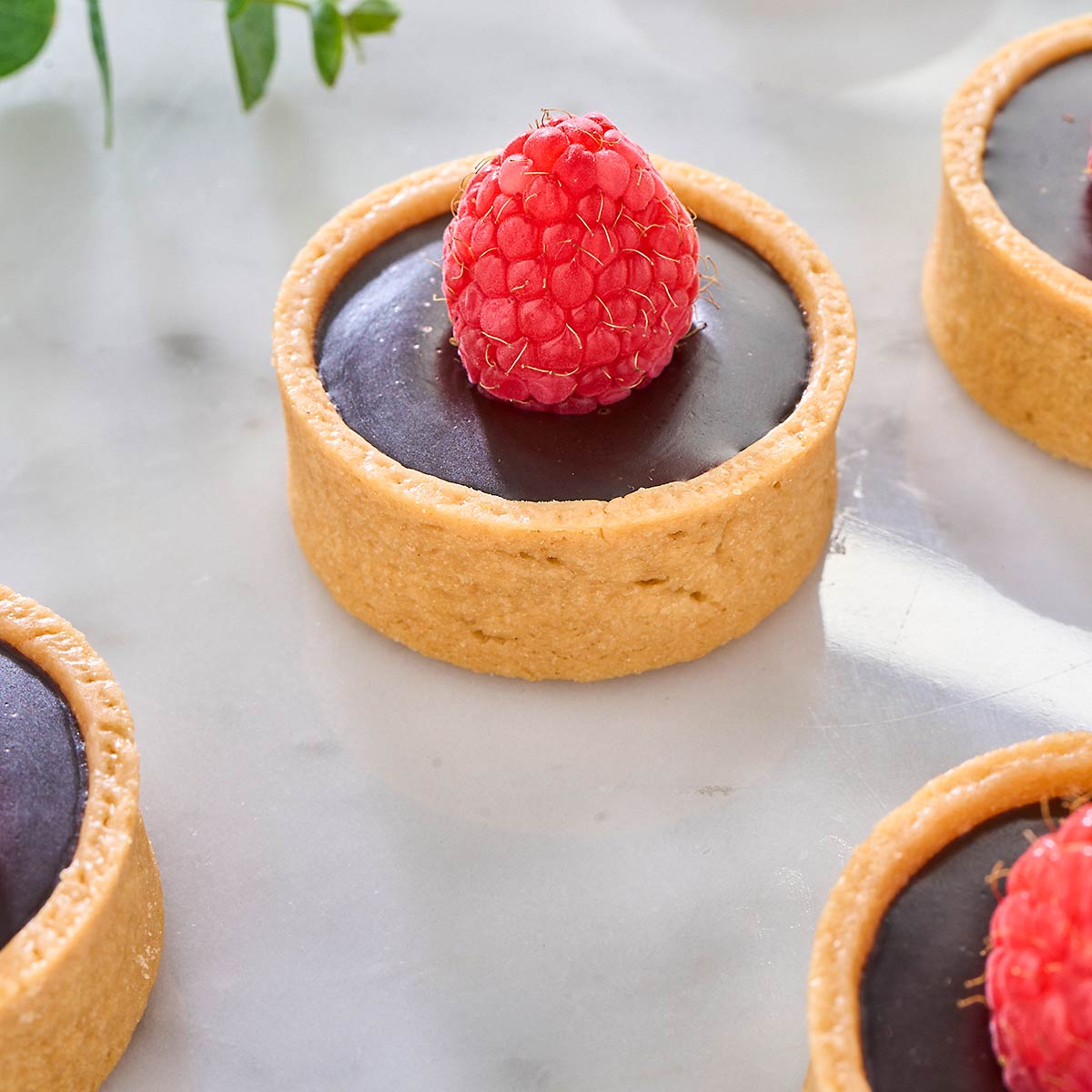 Glossy chocolate with a raspberry on top